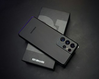 black sony remote control beside white tissue paper