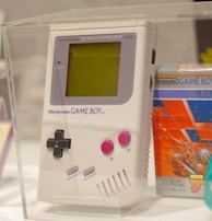 An original nintendo game boy is on display.