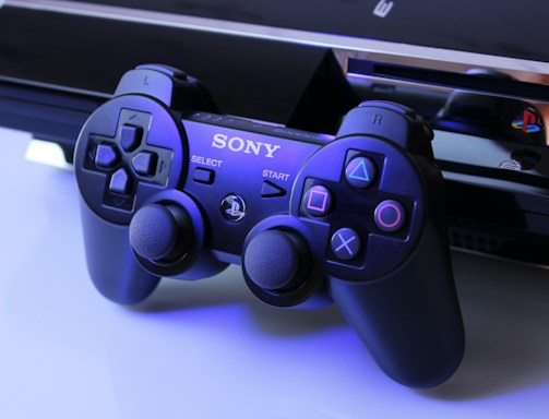 black Sony PS2 controller on white surface