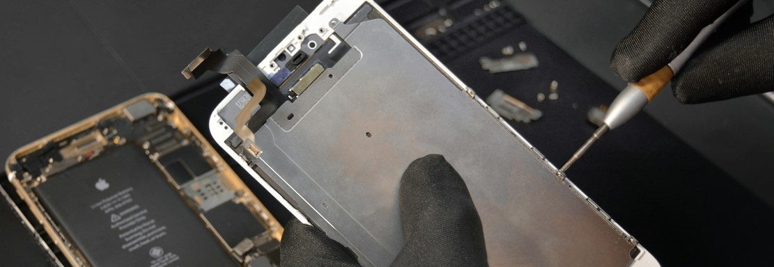 person fixing phone