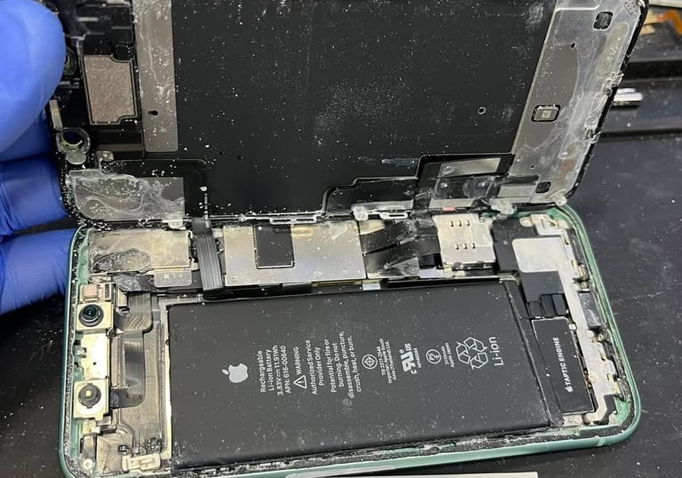 Liquid-damaged iPhone opened for repair